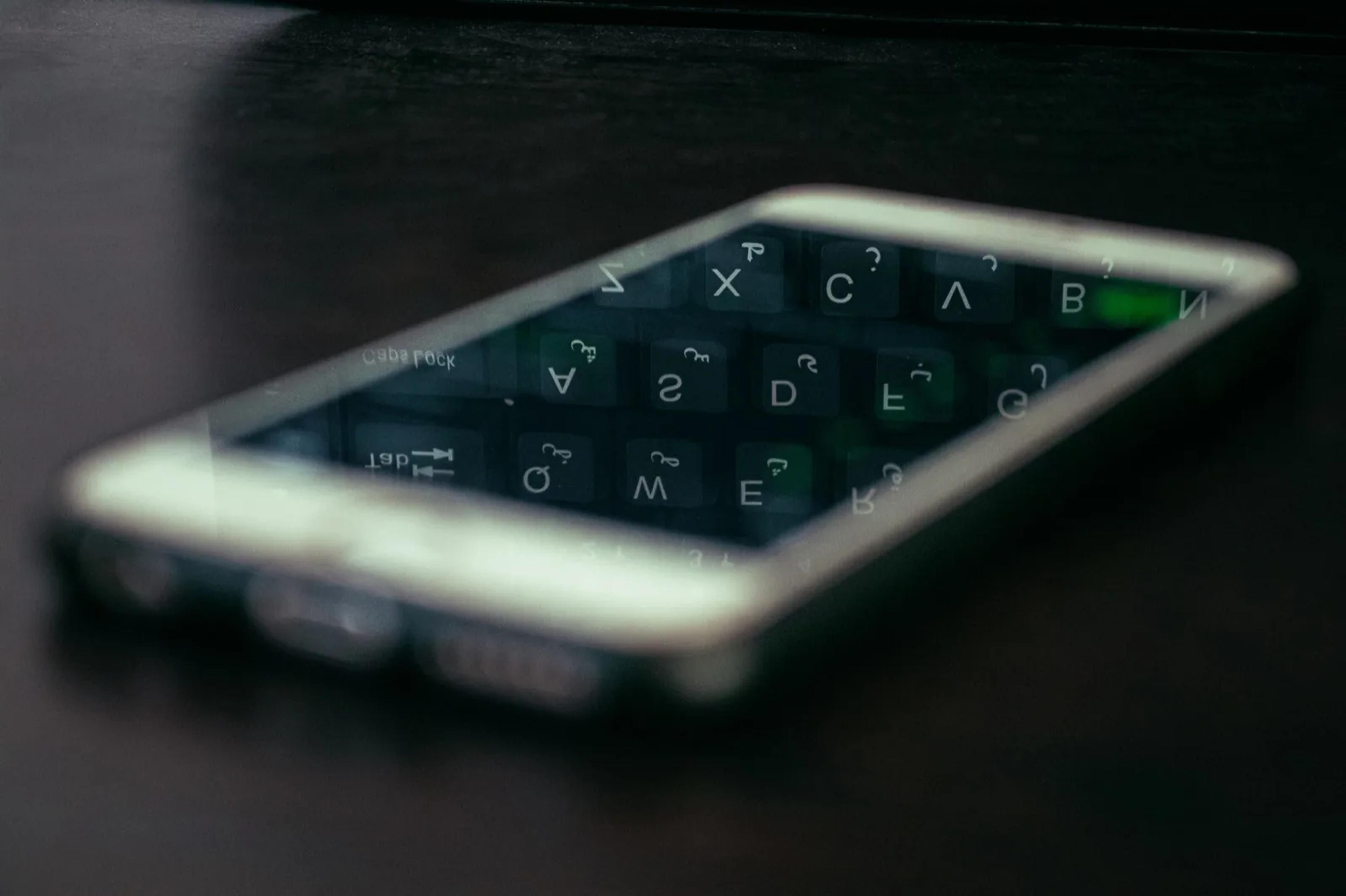 a close up of a cell phone on a table