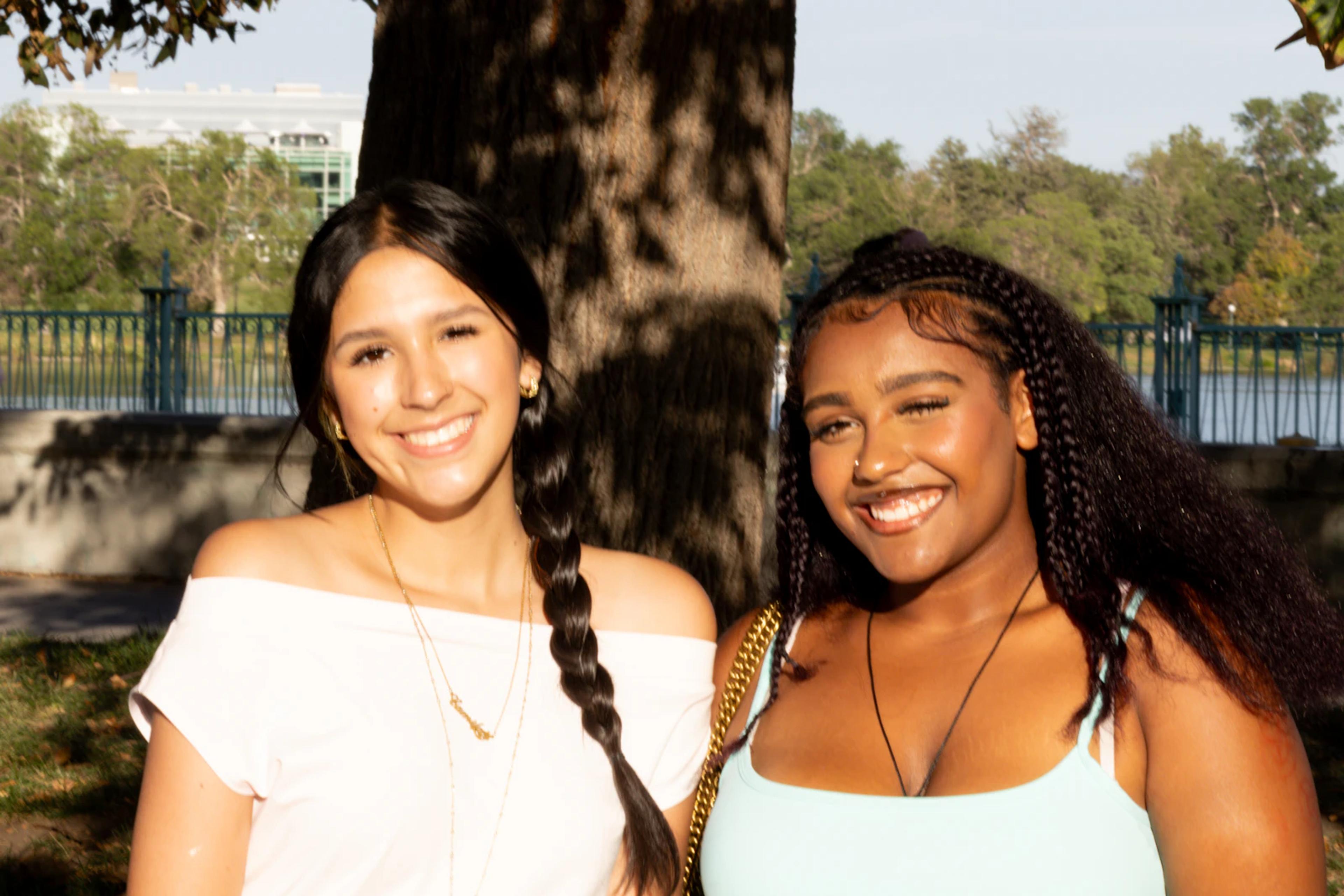 Two young women smiling together