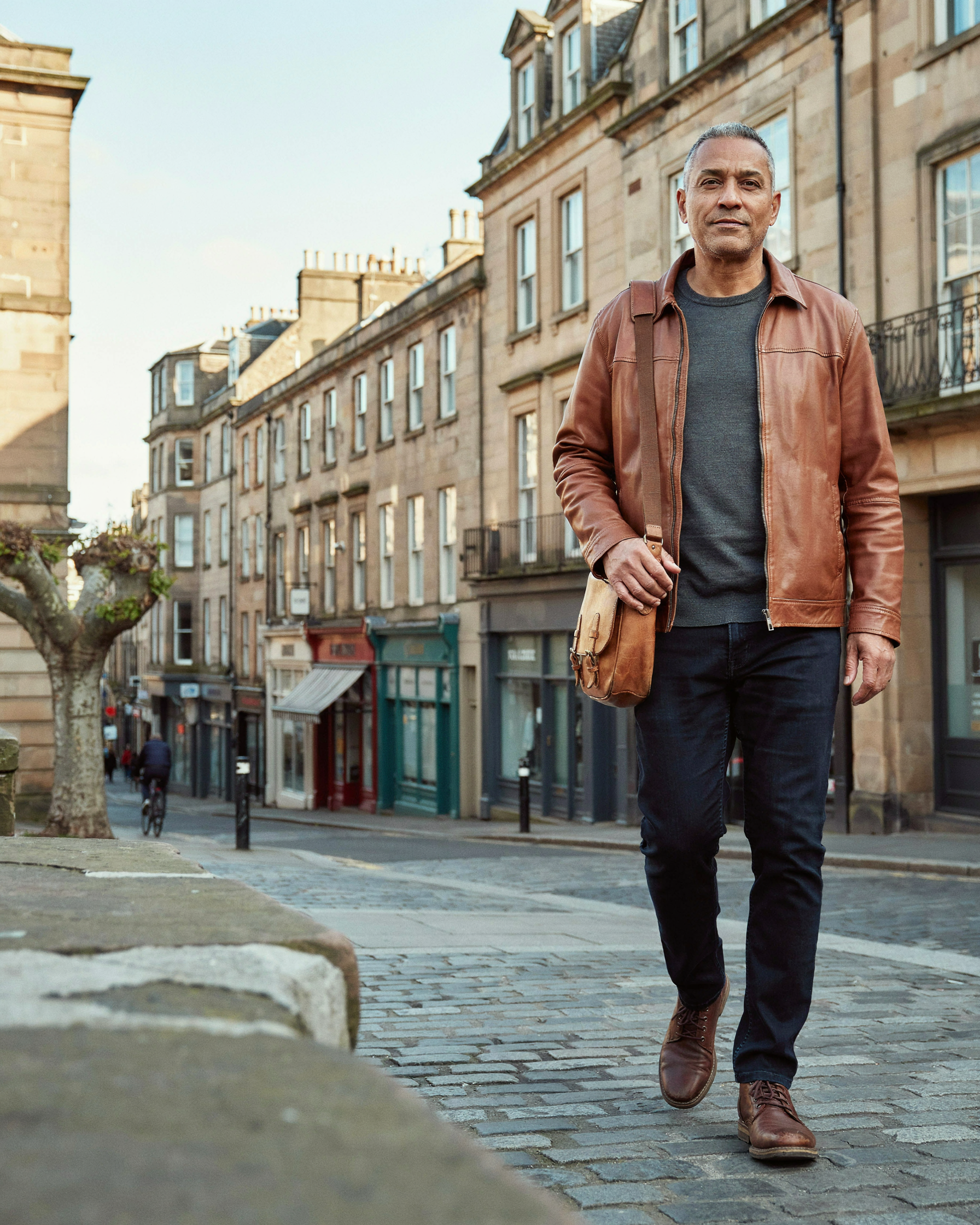 Adult walking along Bruntsfield Place in Edinburgh, relaxed after working out their NHS and private options for weight management