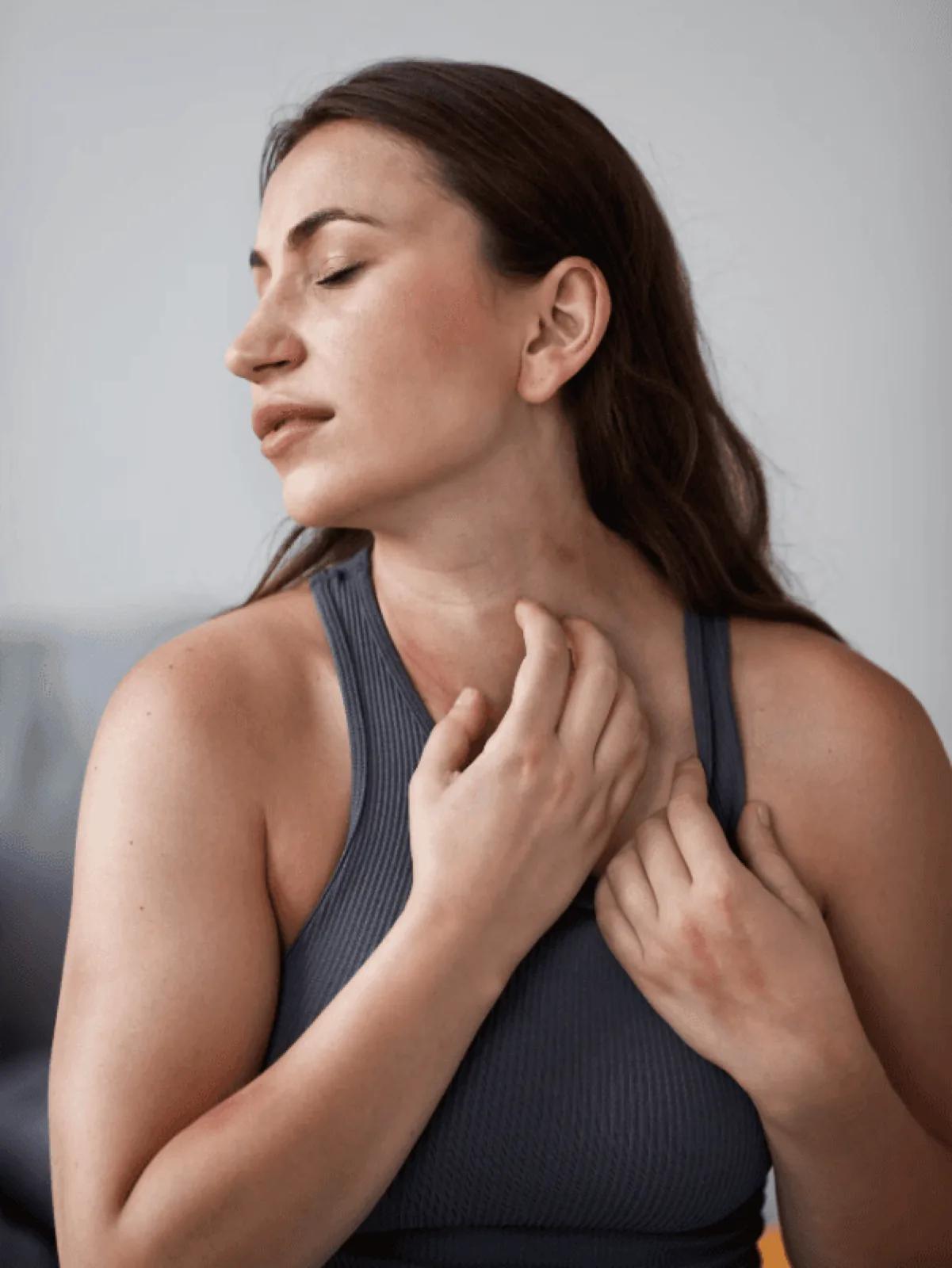 woman scratching skin infection