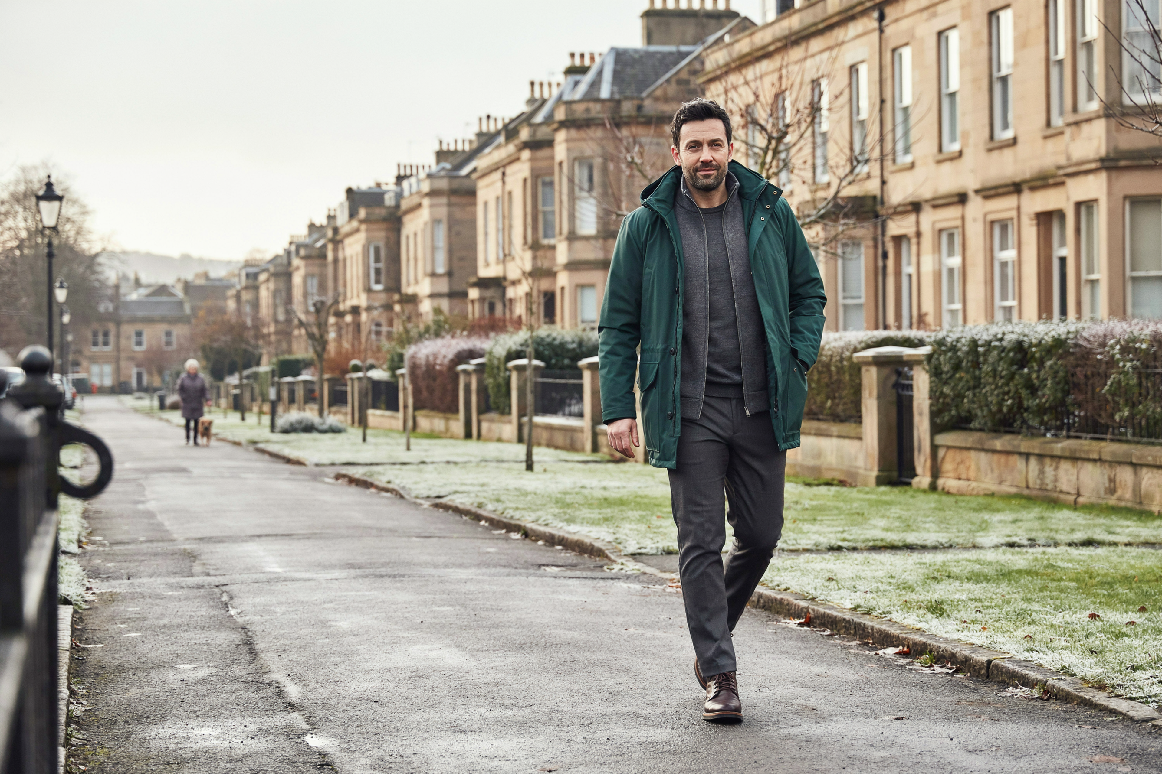 Adult walking along a Merchiston street in Edinburgh on a winter morning, back to their day after a COVID-19 vaccination