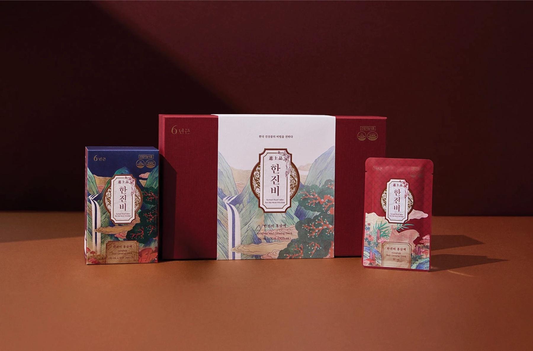 HANJINBI red-ginseng gift box with a pouch and carton on a dark red set