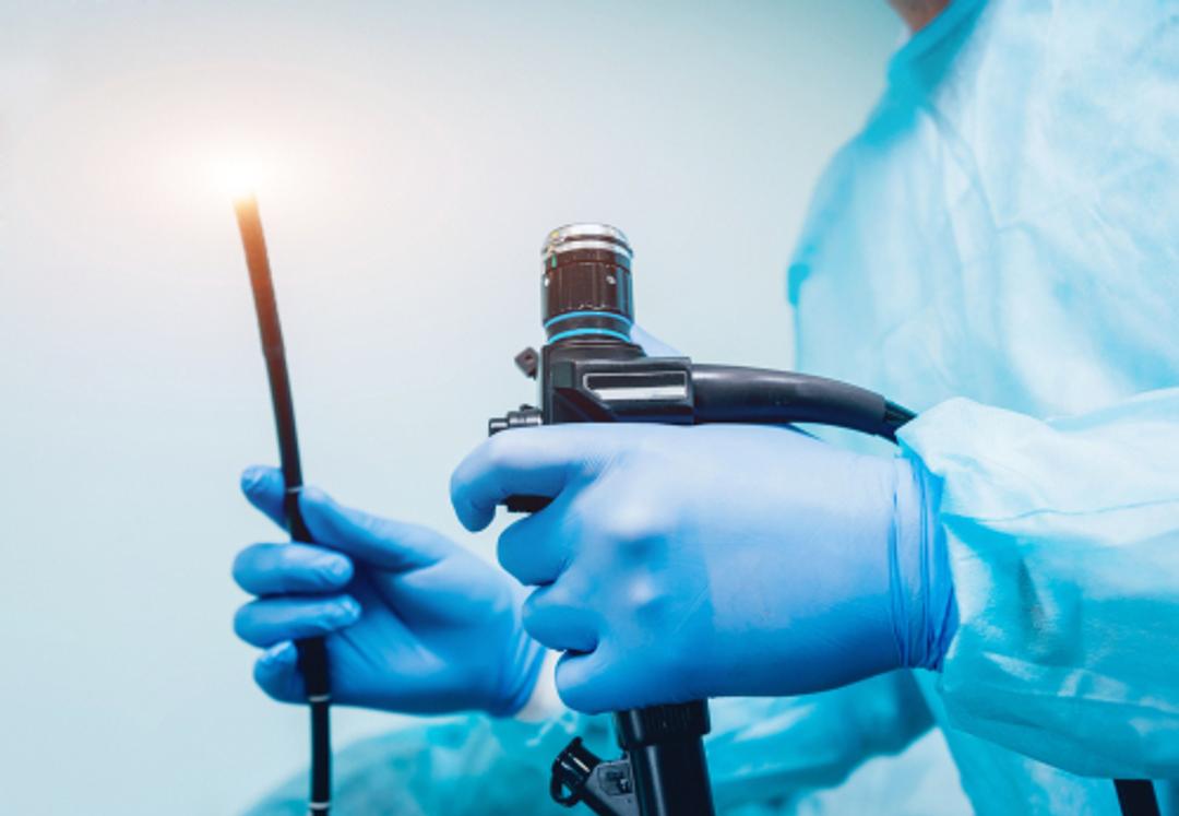 Dr holding camera with light