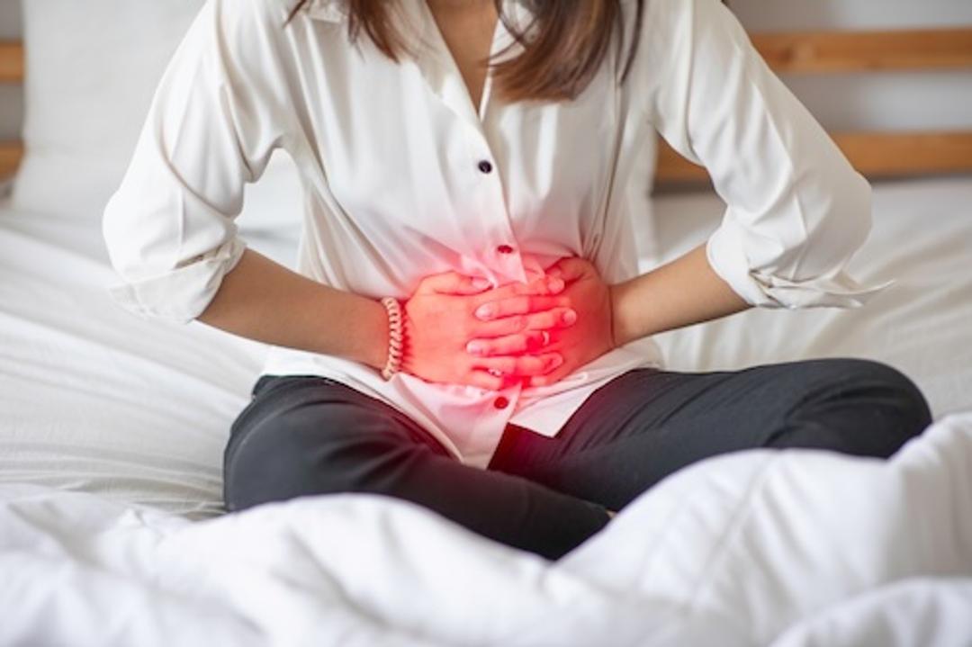 woman holding stomach