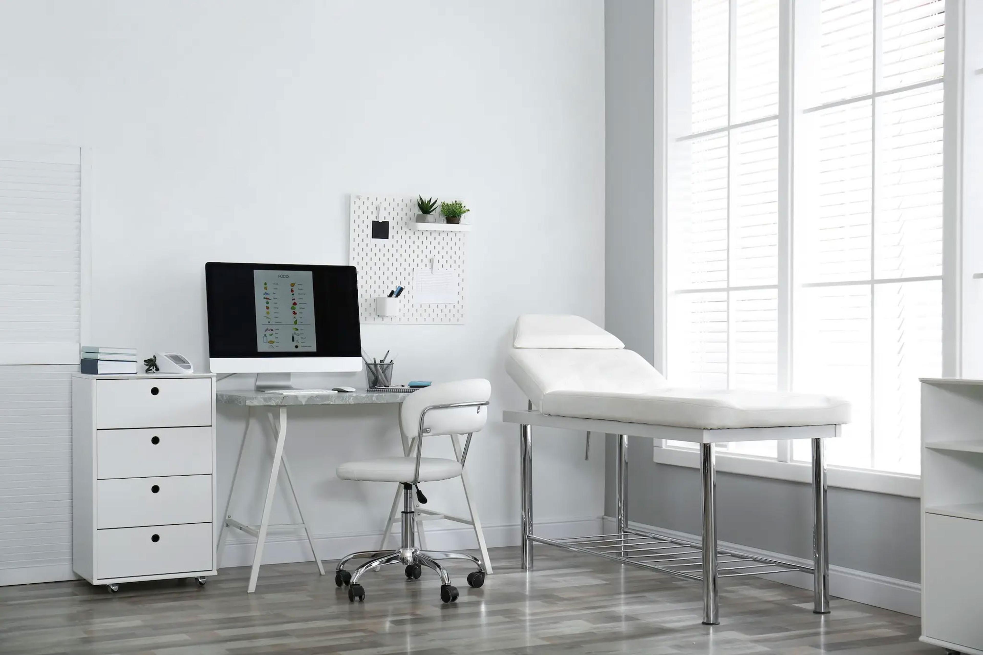 stock-photo-modern-medical-office-interior-with-computer-and-examination-table