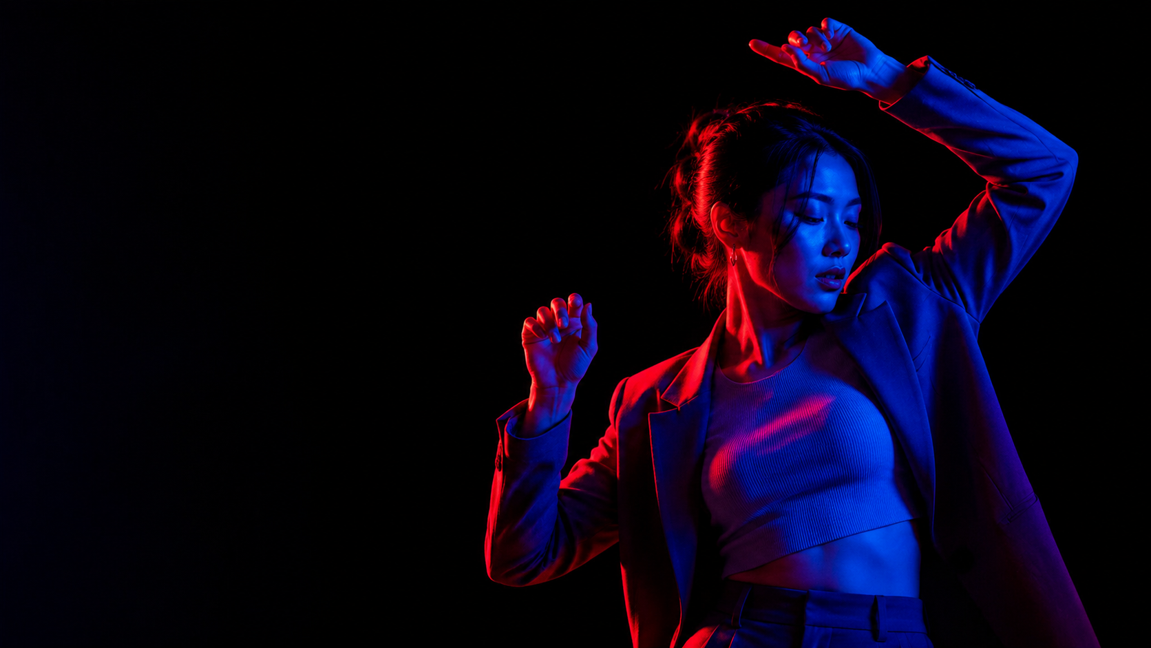 Stylish portrait of a dancing person in neon light