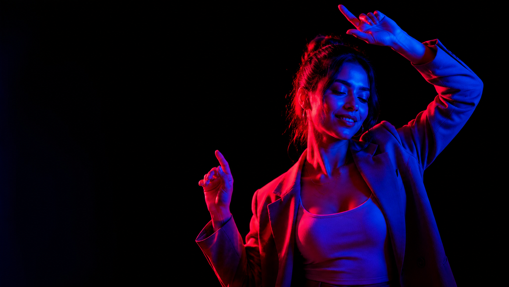 Stylish portrait of a dancing person in neon light