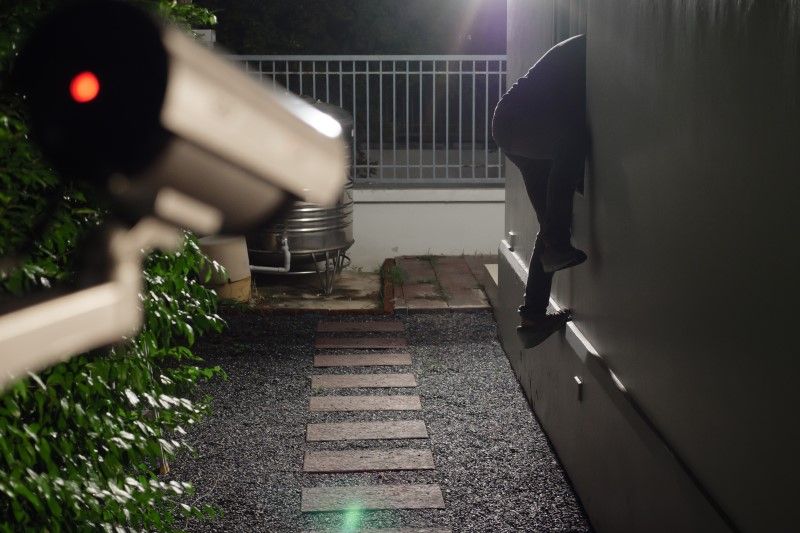 Small business owner reviewing security camera footage with ATTEST