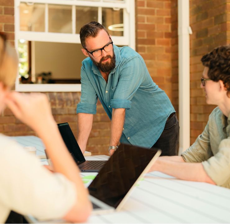 Researchers reviewing notes from a discovery session