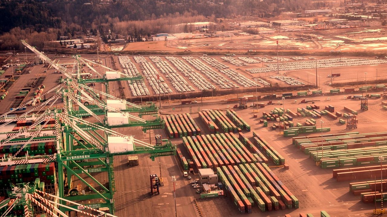Container cranes and stacked shipping containers at the Port of Tacoma, seen from above