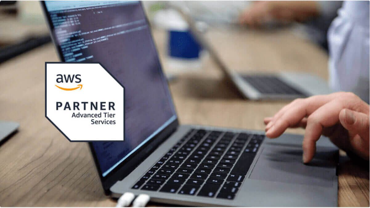 A laptop with an AWS Advanced Tier Partner badge overlaid on top of it.