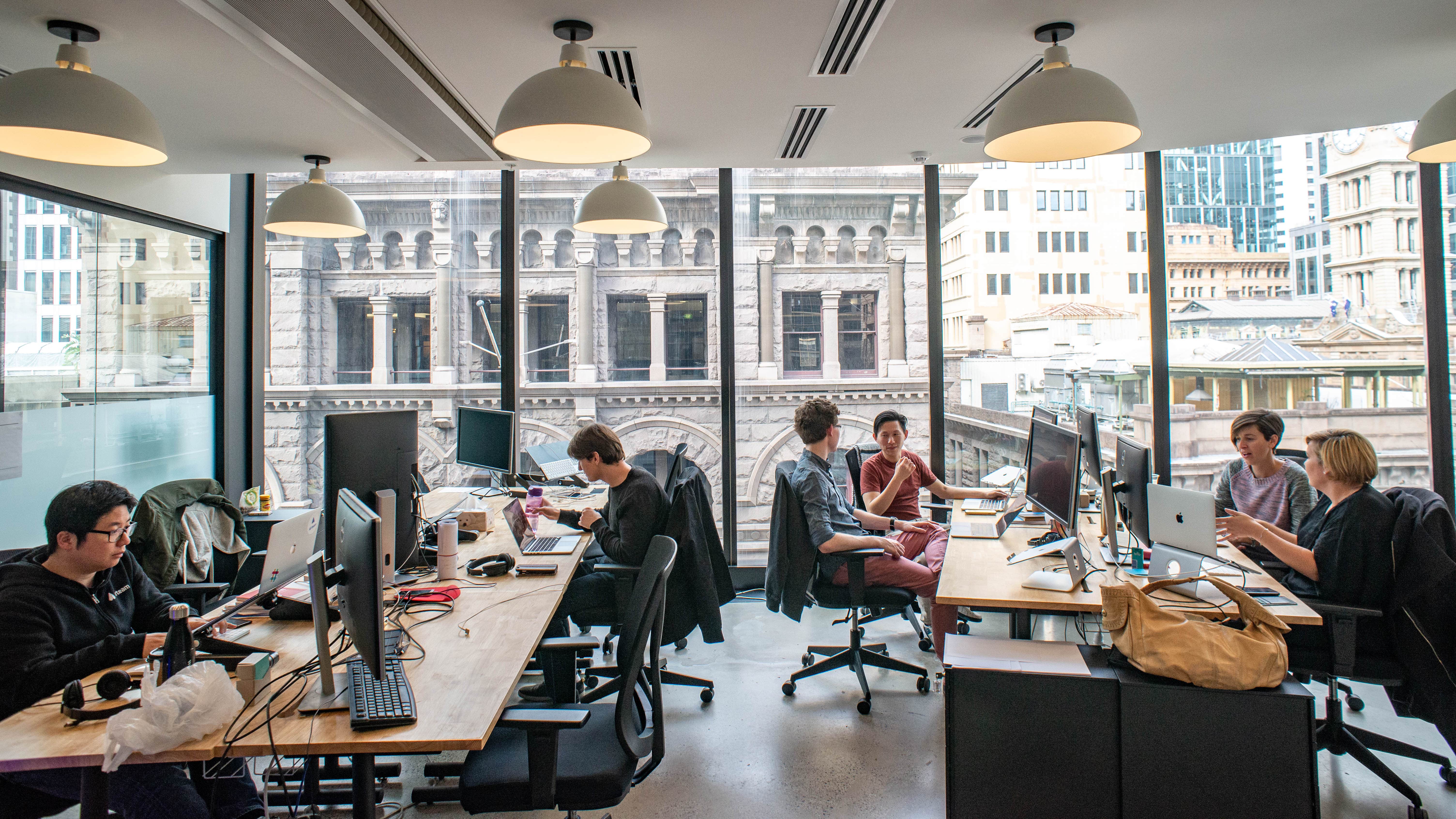 Airteam designer and developer team members working together in a Sydney office.