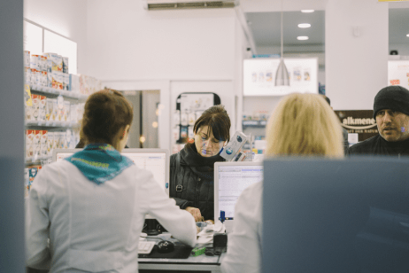 A doctor working on her laptop at her desk.