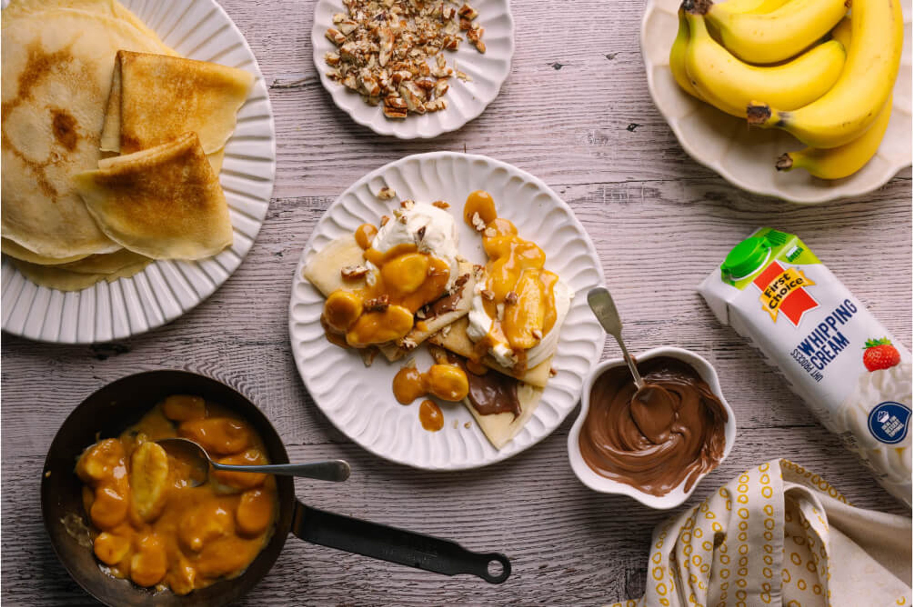 Pancakes With Nutella, Whipped Cream And Butterscotch Bananas