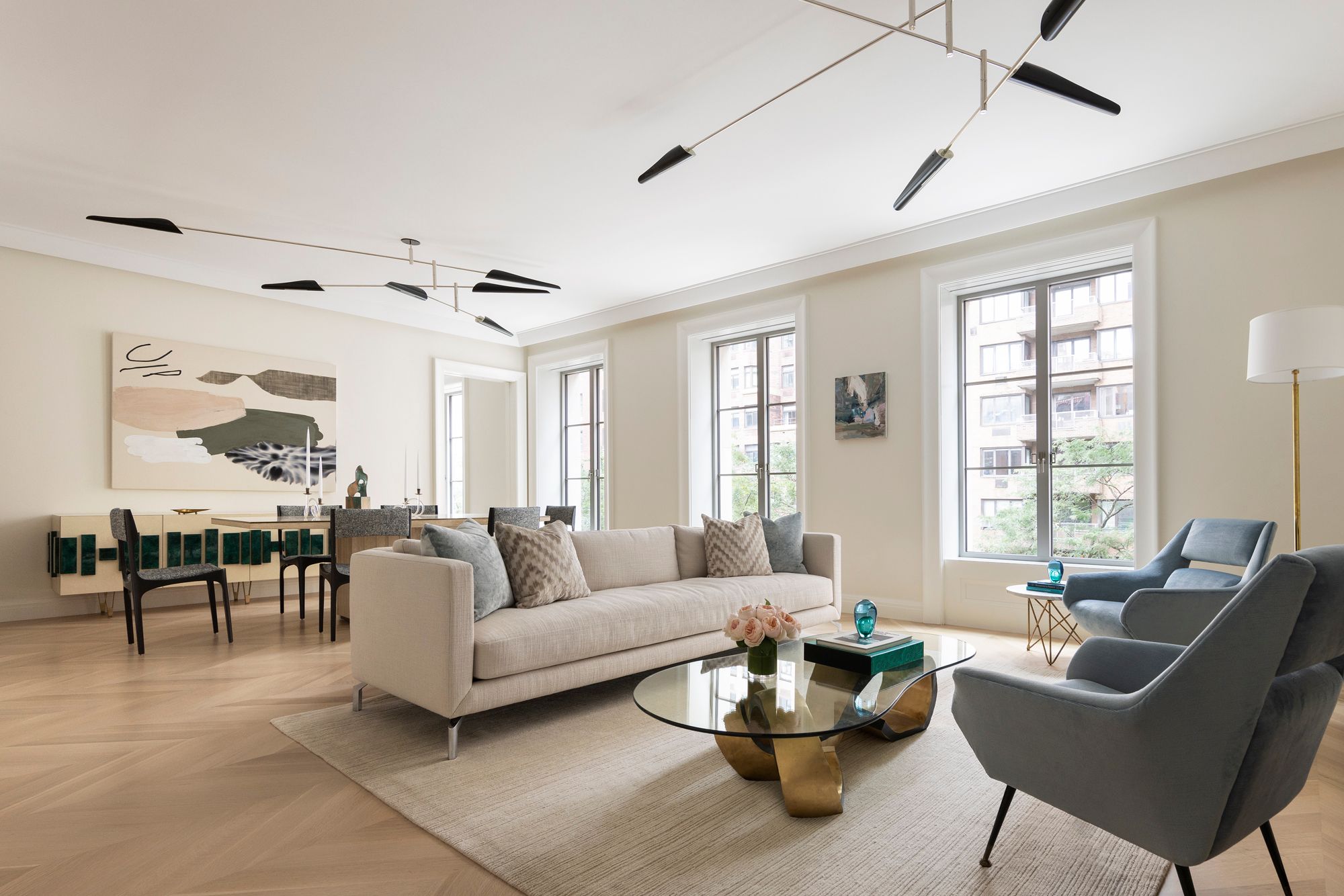 South-facing living and dining room overlooking tree-lined East 79th Street