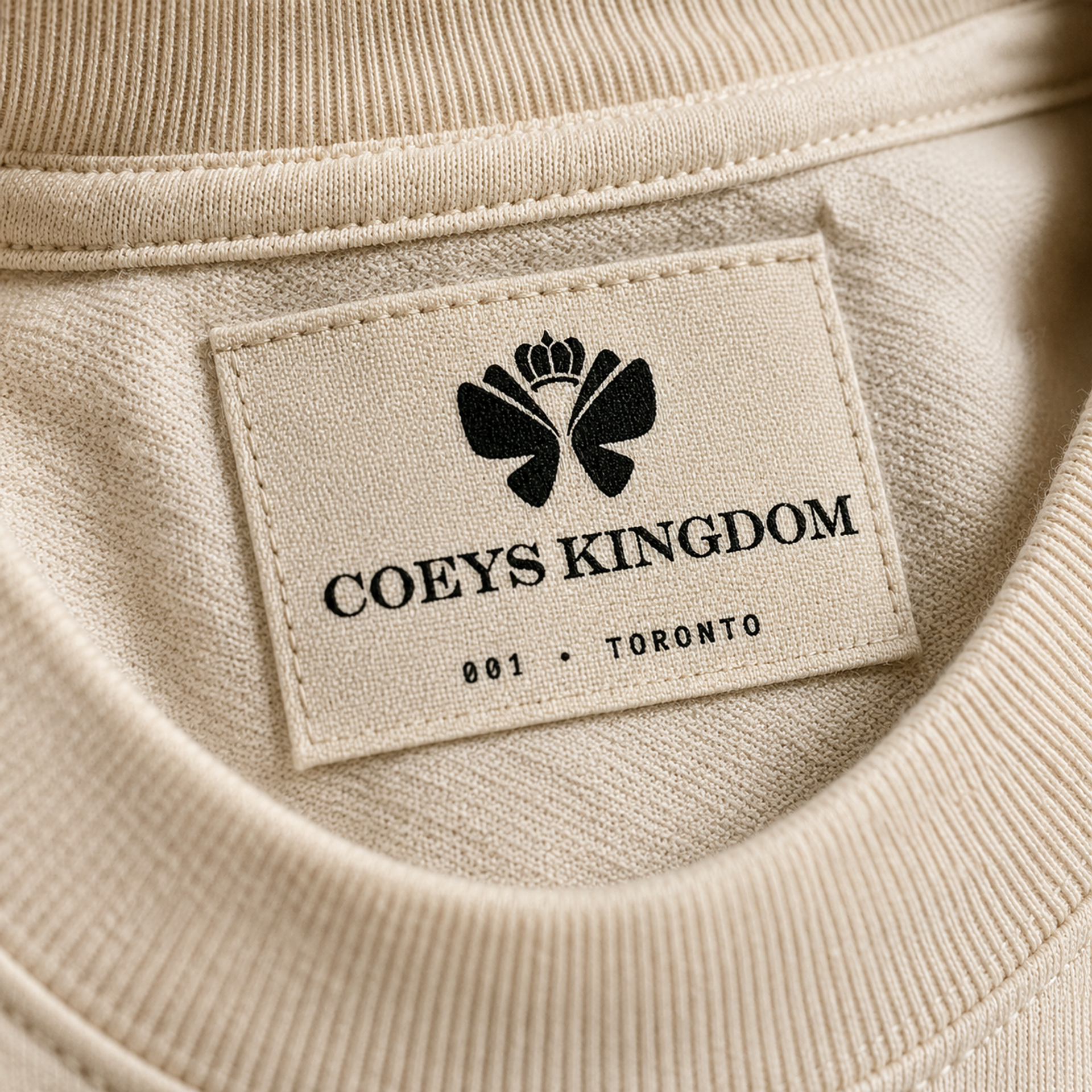 Coeys Kingdom 棉质内标特写 —— 皇冠 logo + 001 · TORONTO 编号