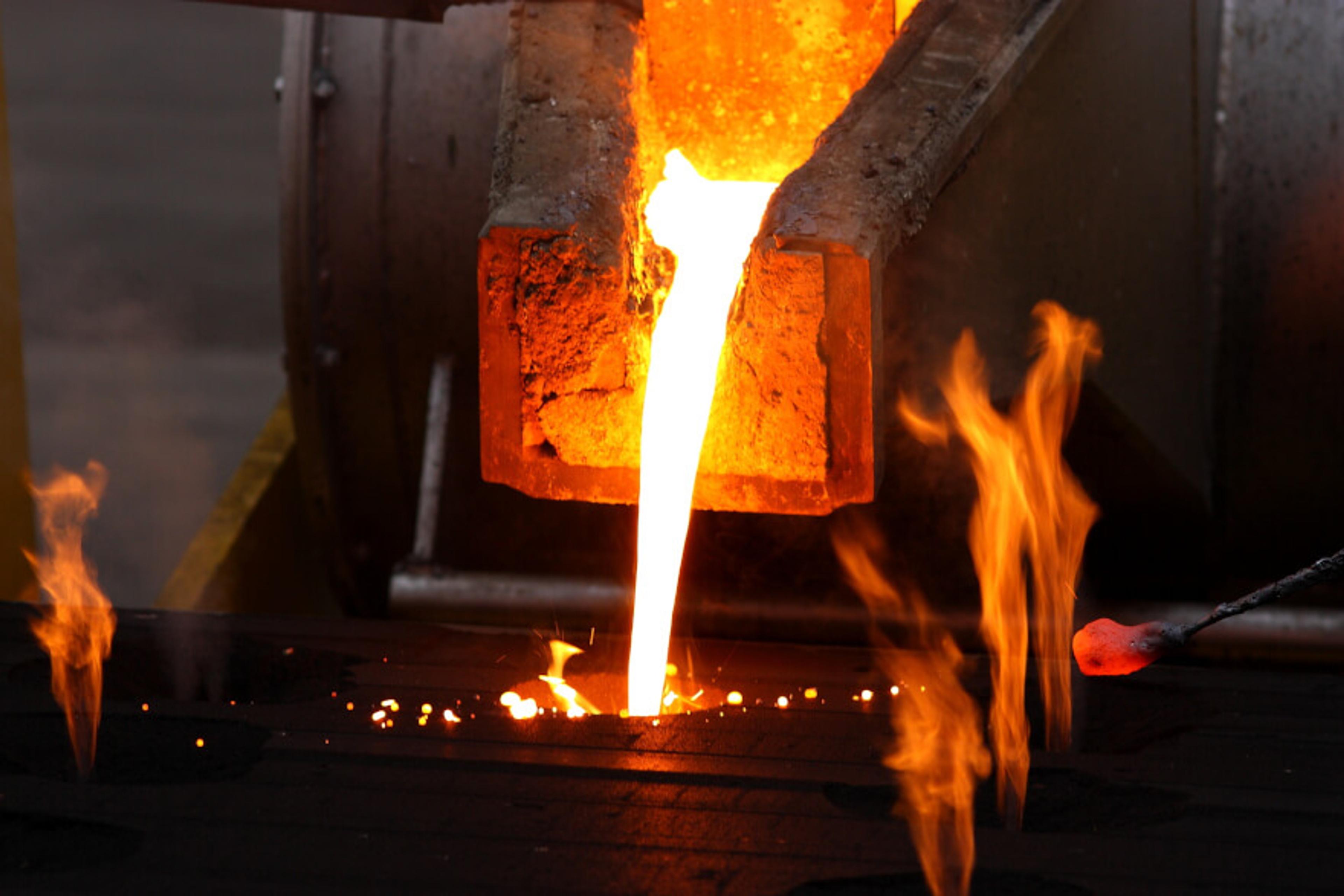 Molten metal poured from a lathe for casting