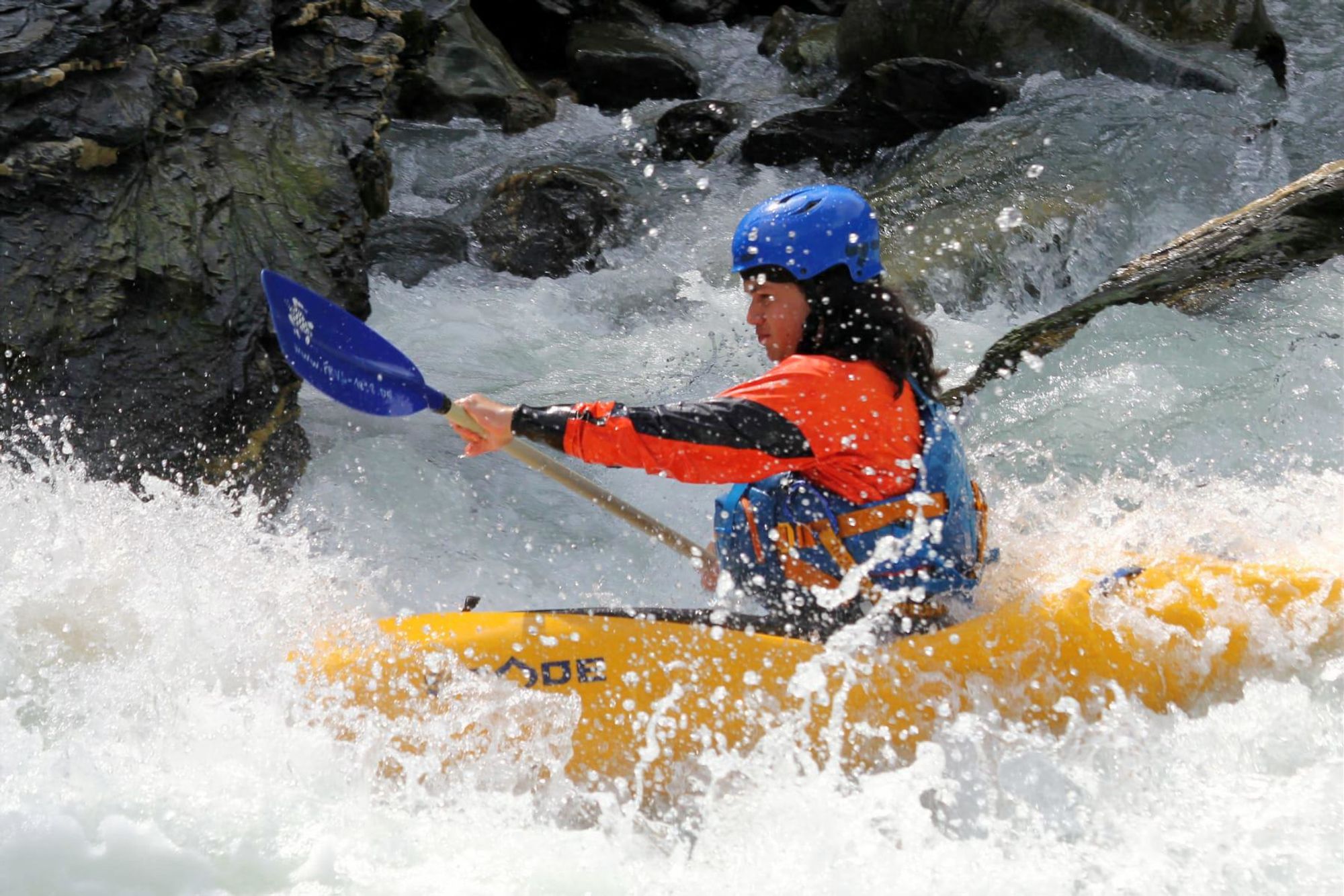 Kayak in whitewater – paddler in the middle of the rapids