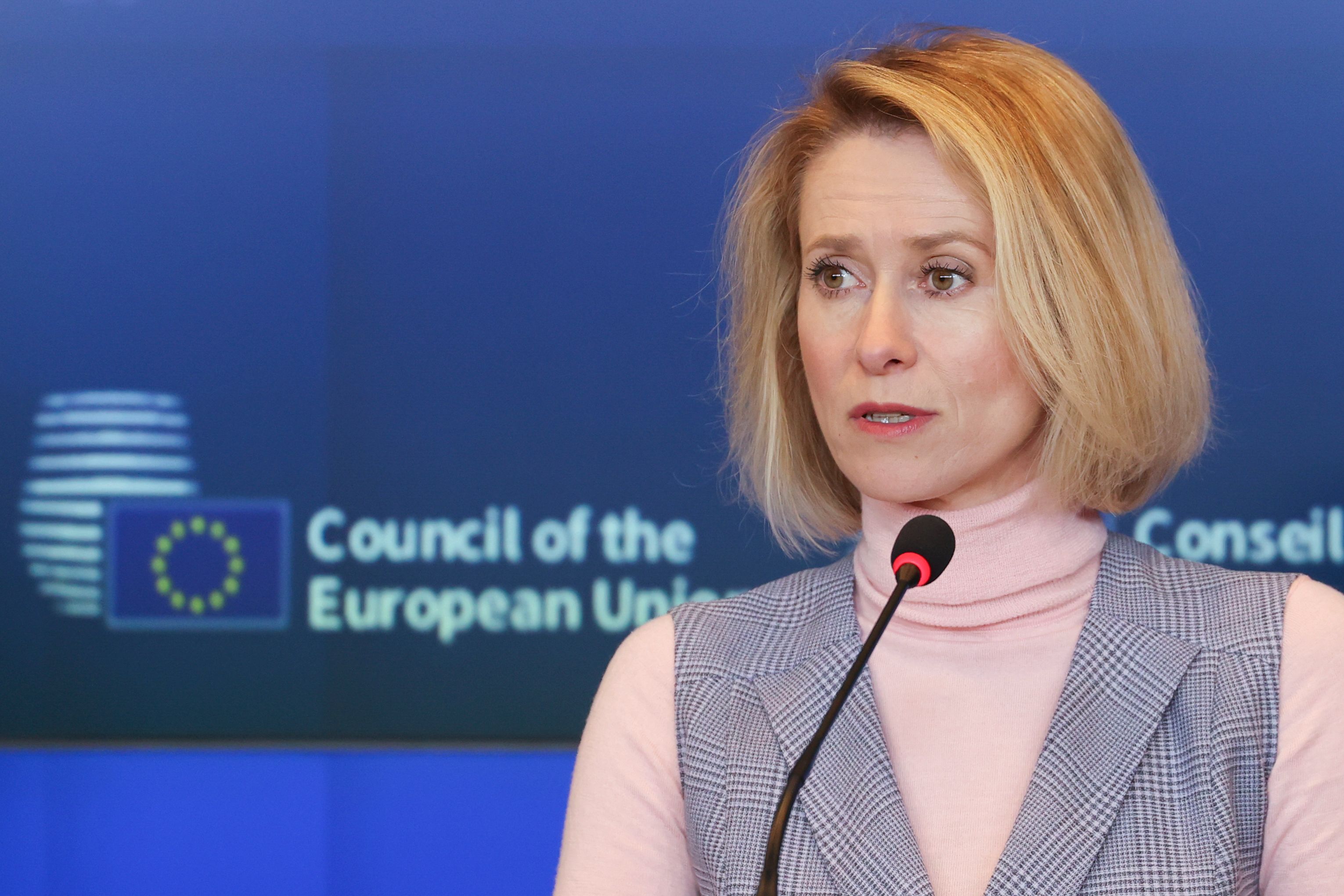 Kaja Kallas speaking at a press conference with the Council of the European Union logo in the background.