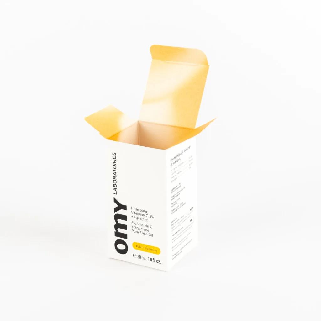 Omy Laboratoires packaging detail showing custom color and finish