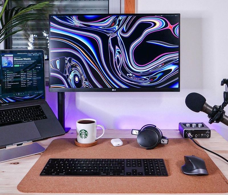 Designer's minimal setup with 27 inch monitor and Macbook Pro 15