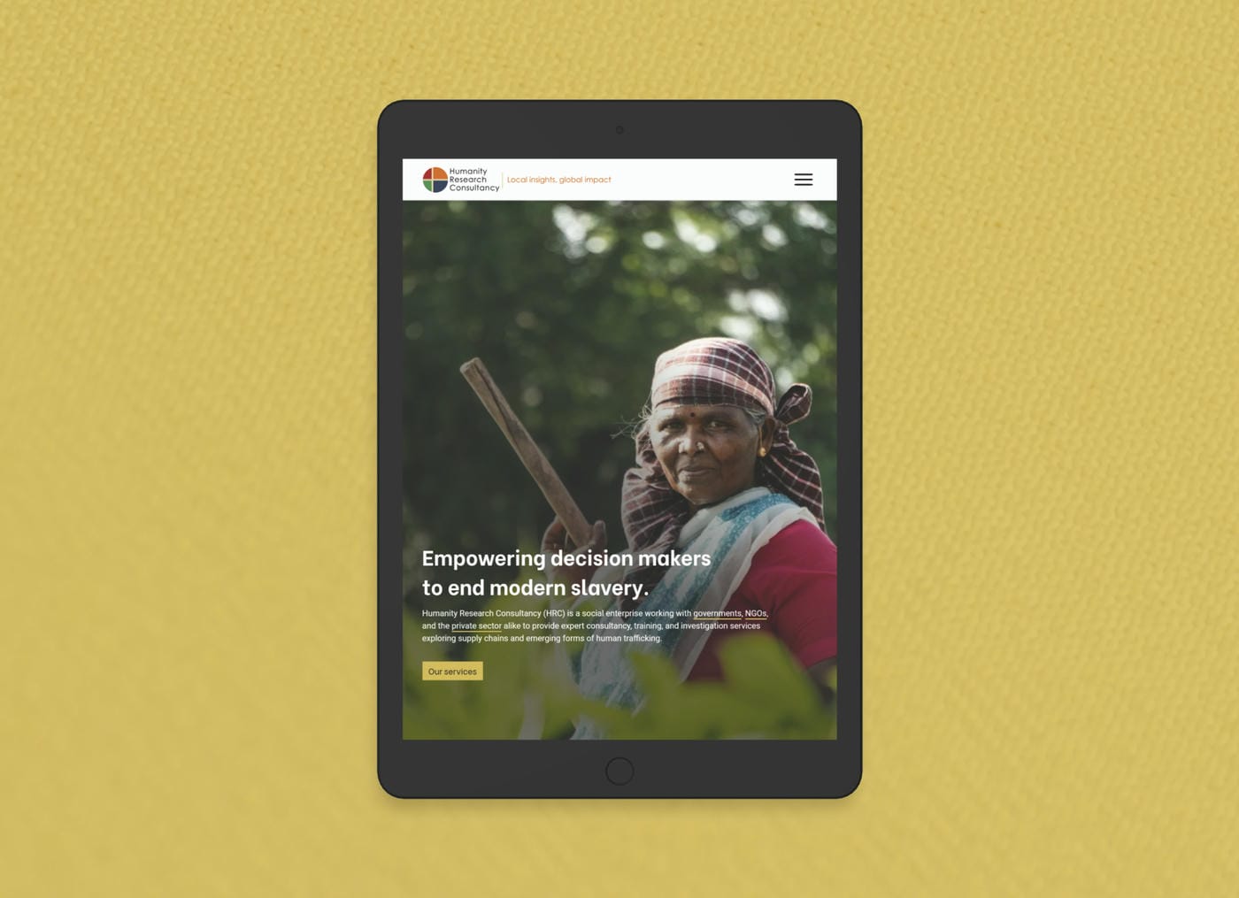 Website hero design on a tablet for the social enterpise Humanity Research Consultancy