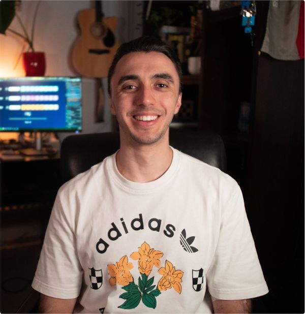 Lucian Chevallier, founder of Lumin web design, development & strategy, sat in front of his computer screens.