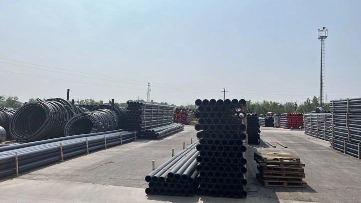 HDPE pipes stacked in a storage yard