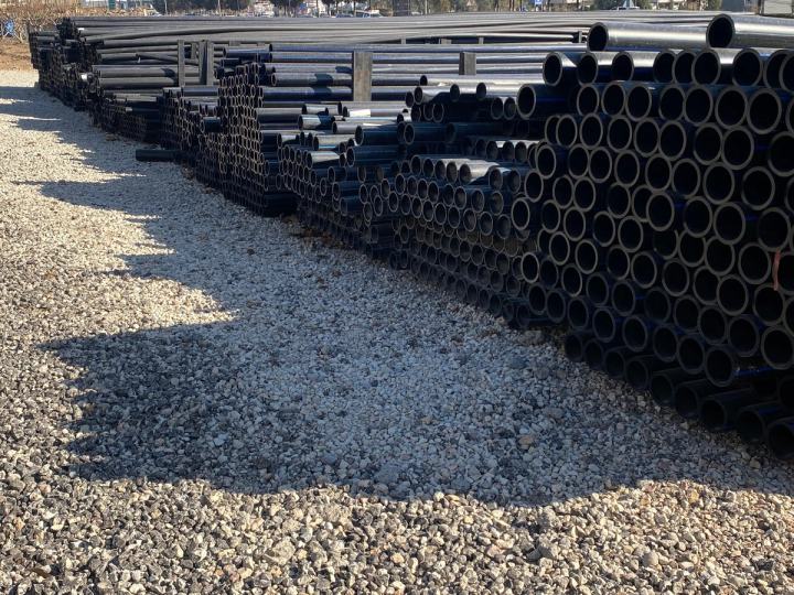 HDPE pipes stacked in a storage yard