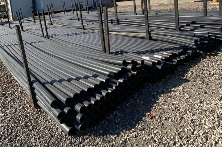 HDPE pipes stacked in a storage yard