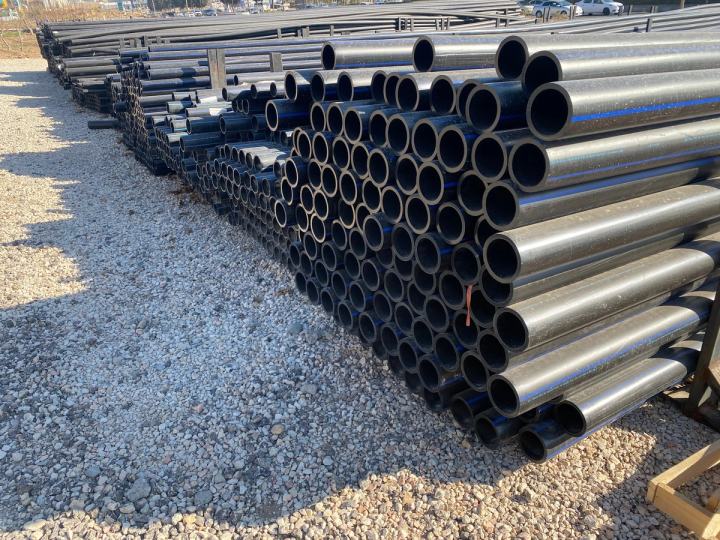 HDPE pipes stacked in a storage yard
