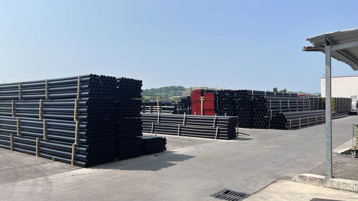 HDPE pipes stacked in a storage yard