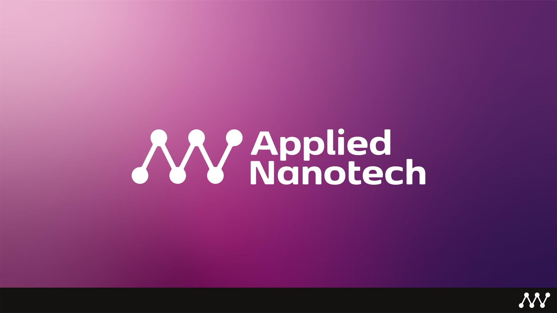 The Applied Nanotech mark reversed on the brand gradient