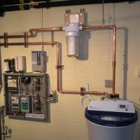 Completed: Water Filter and Water Softener Installation in a Utility Room