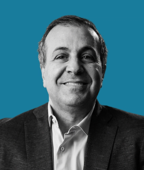 Brian Ricci black and white headshot against blue background