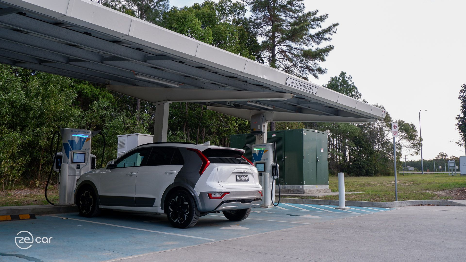 Kia Niro EV at charging station and mobile app