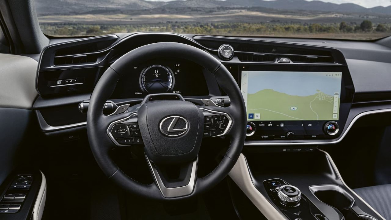 Lexus RZ interior with three-spoke steering wheel and touchscreen displaying map