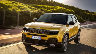 Jeep Avenger electric SUV exterior front three-quarter angle driving on road