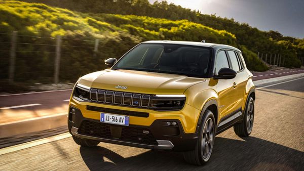 Jeep Avenger electric SUV exterior front three-quarter angle driving on road