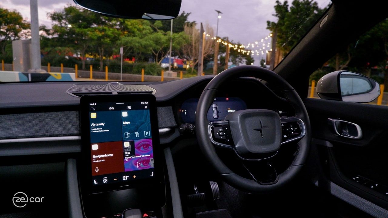 Polestar 2 interior touchscreen and steering wheel at night