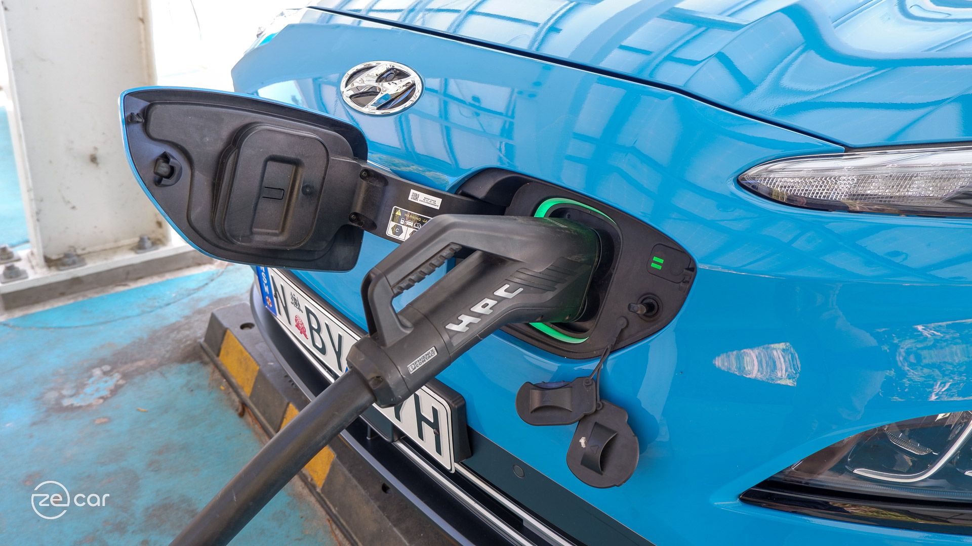 Blue Hyundai Kona Electric charging port and 'electric' tailgate badge