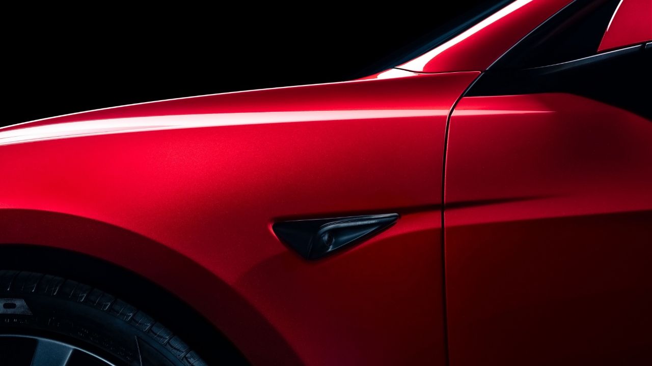 2024 Red Tesla Model 3 facelift camera side