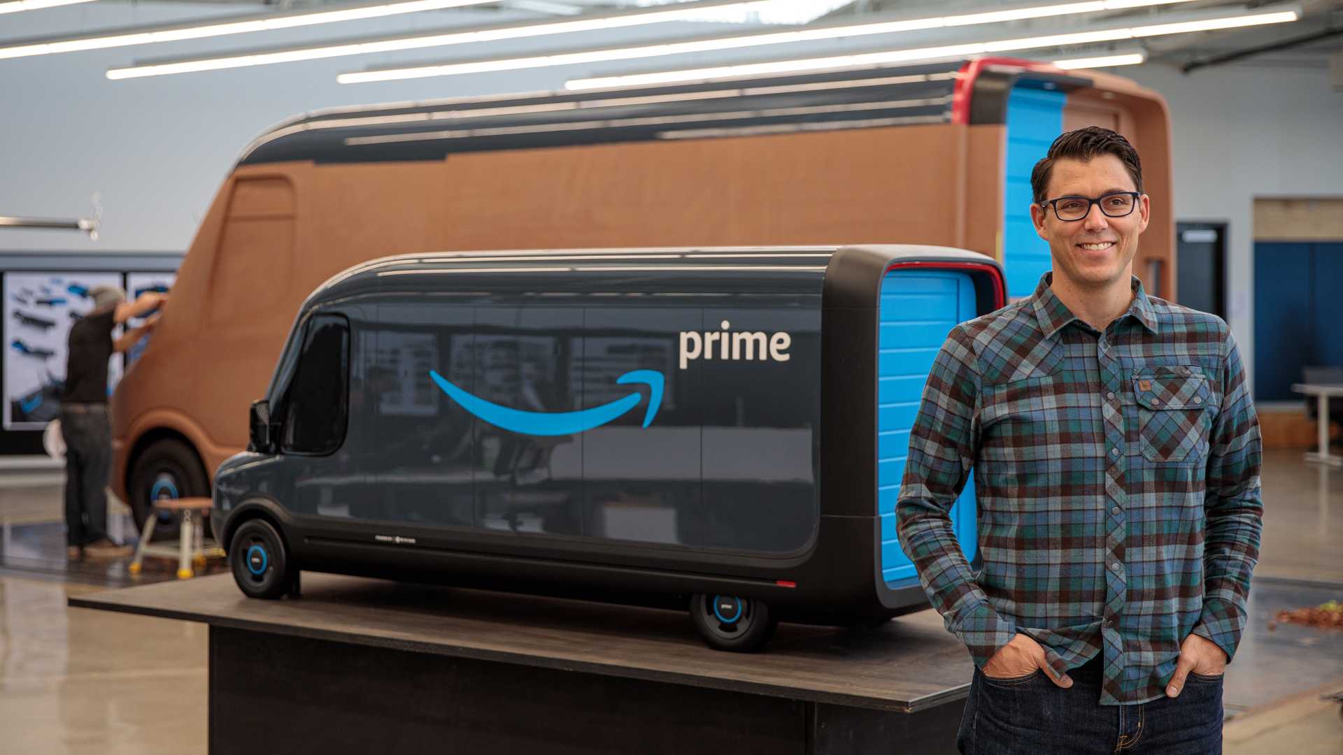 Rivian founder and CEO RJ Scaringe in front of EDV for Amazon Prime