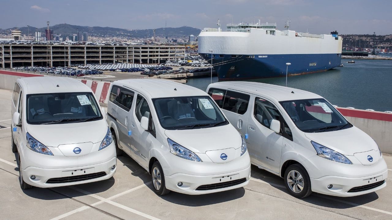 Nissan e-NV200 white vans at shipping port