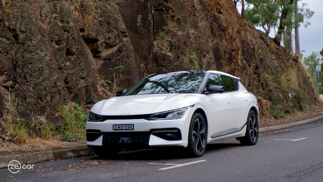 White Kia EV6 GT-Line in front of rocks