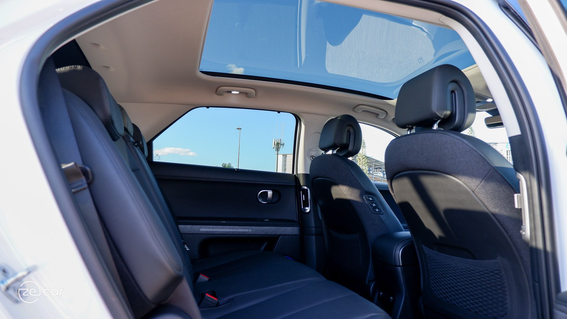 Hyundai Ioniq 5 black interior rear row and glass roof