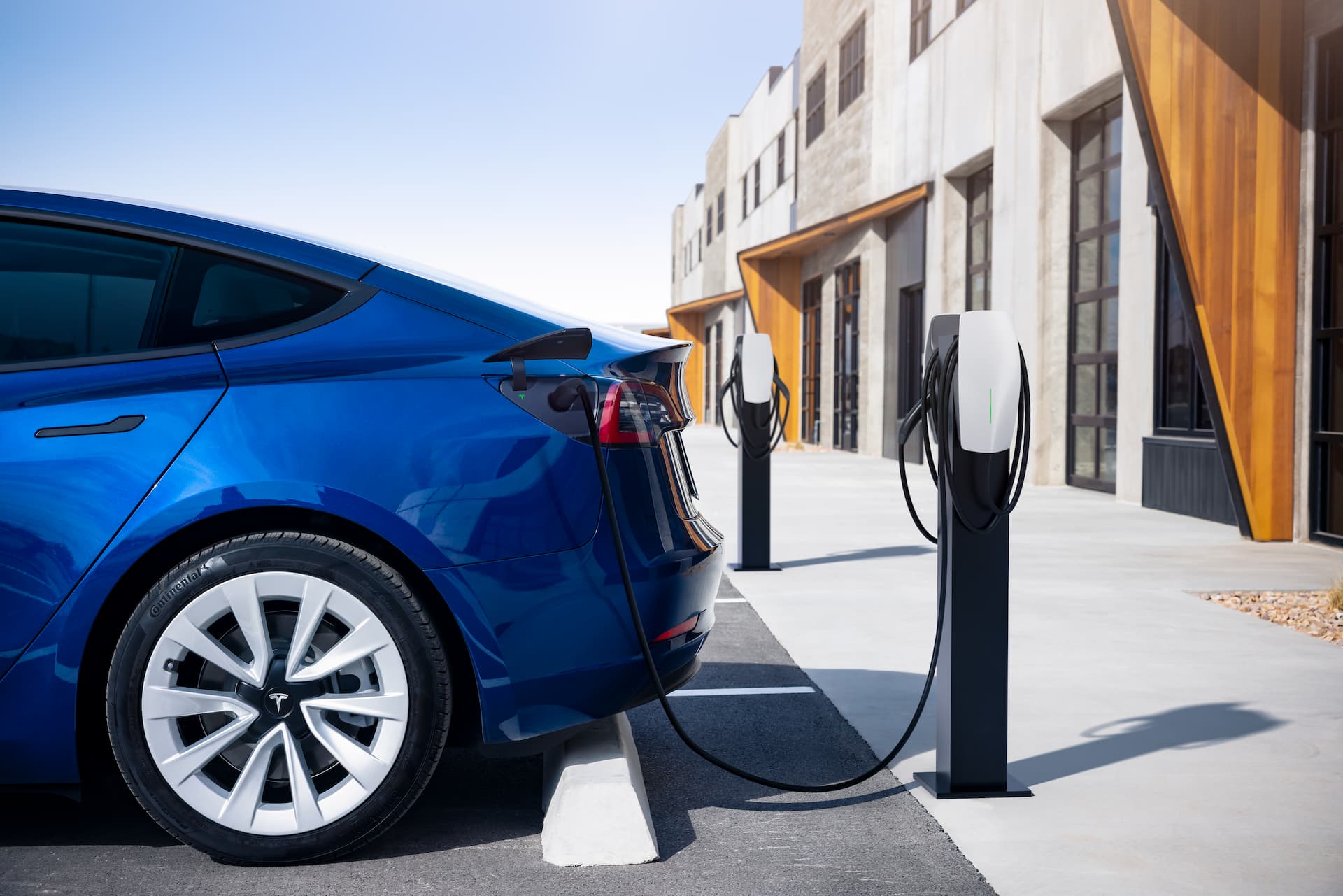 Blue Tesla Model 3 destination charging