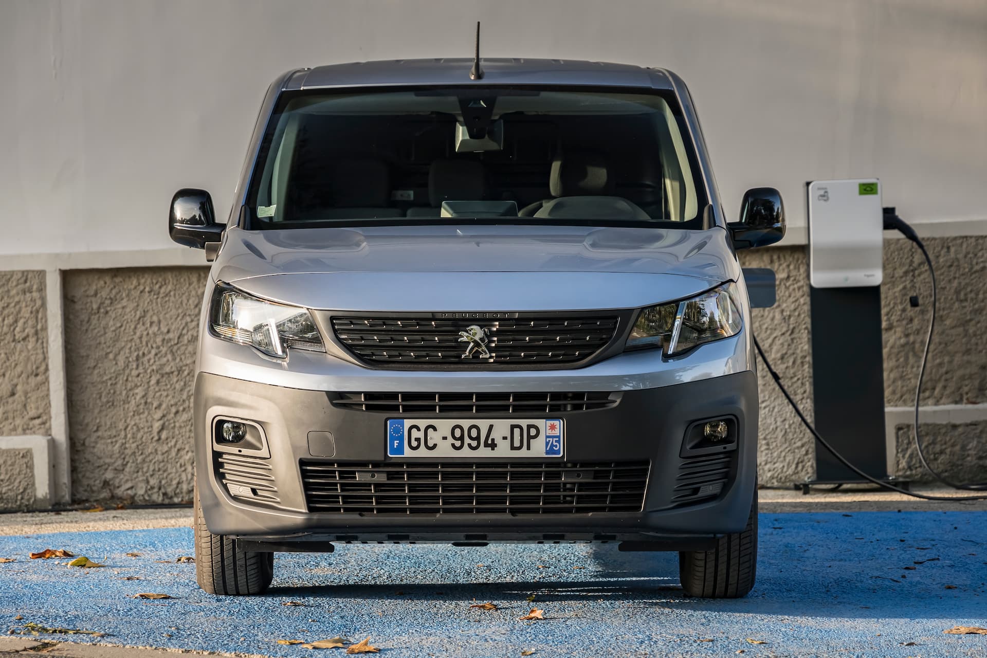 Peugeot e-Partner van charging from AC charger front view