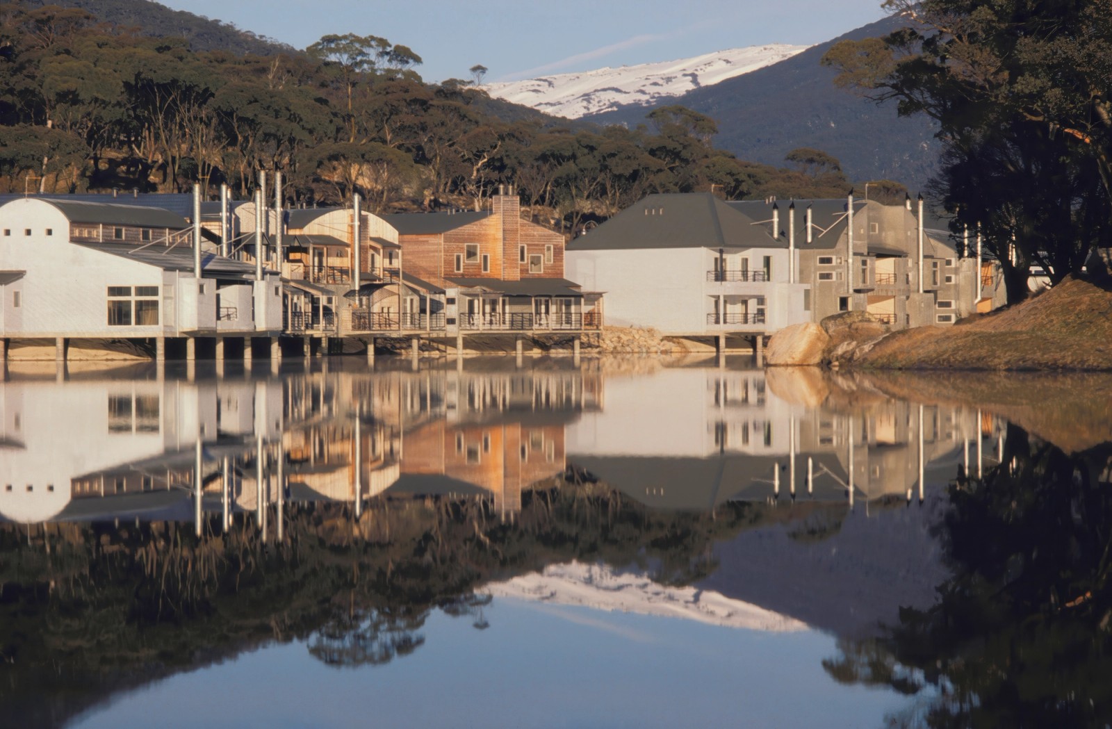 Lake Crackenback Village - A series of cohesively different buildings hovering over the edge of a man-made lake, looking north towards the southern slopes of Perisher.