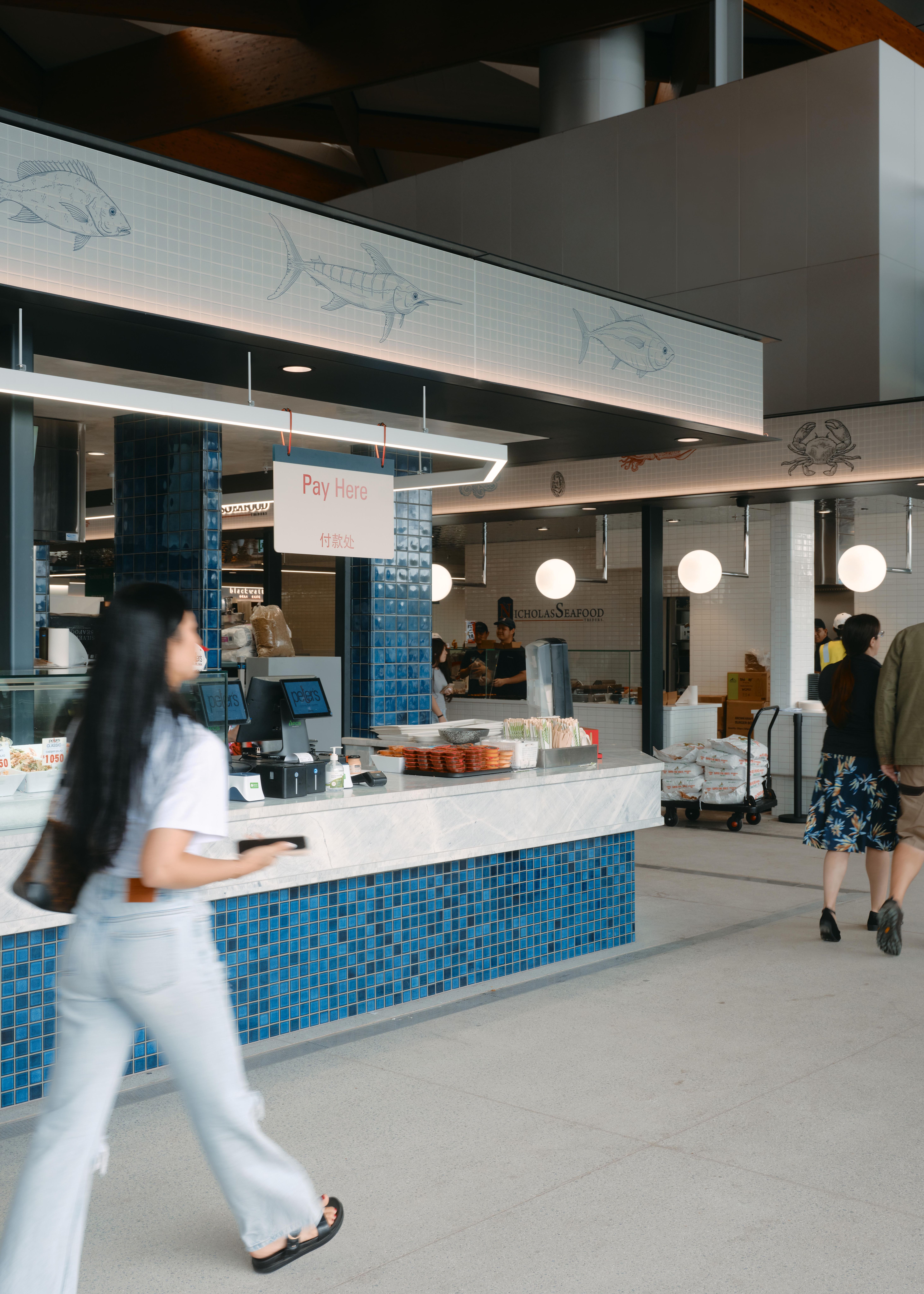 BVN Architecture Sydney civic architecture — New Sydney Fish Market interior, community retail hall with blue tile detailing